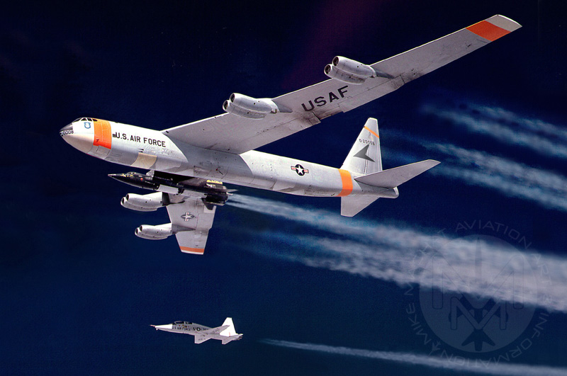 B-52 Mothership 008 with X-15 under the starboard wing, T-38 chase plane below