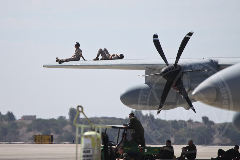 Marine C-130 crew members take a break